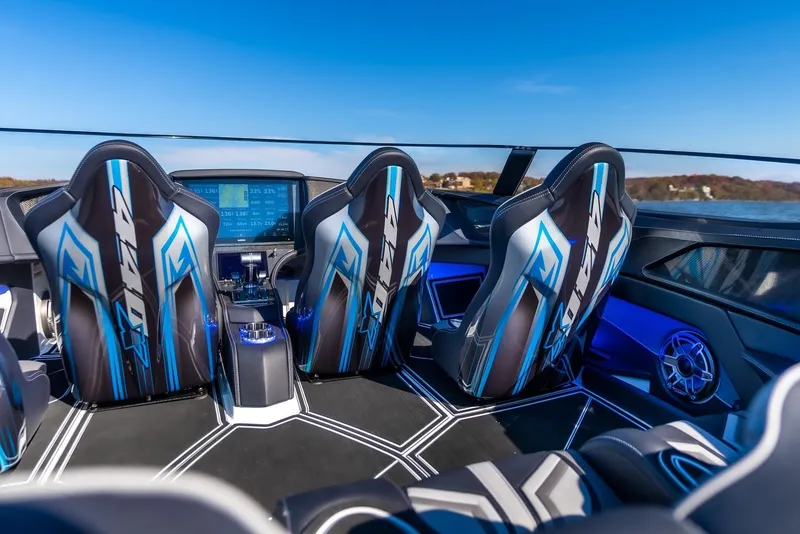 Slide: The Image of Interior of 2025 MTI 440X boat with modern seats and advanced dashboard. - 11