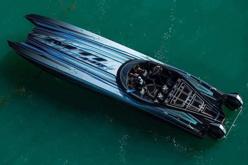 Slide: The Image of 2025 MTI 440X powerboat on turquoise water, aerial view. - 3