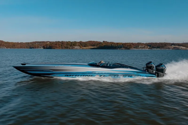 Slide: The Image of 2025 MTI 440X speedboat cruising on a lake. - 5