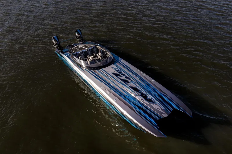 Slide: The Image of 2025 MTI 440X powerboat on water, aerial view. - 7