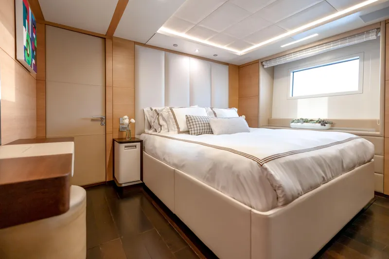 Slide: The Image of Luxurious bedroom interior on 2012 Benetti Classic Supreme 132 yacht, featuring elegant design and cozy ambiance. - 16