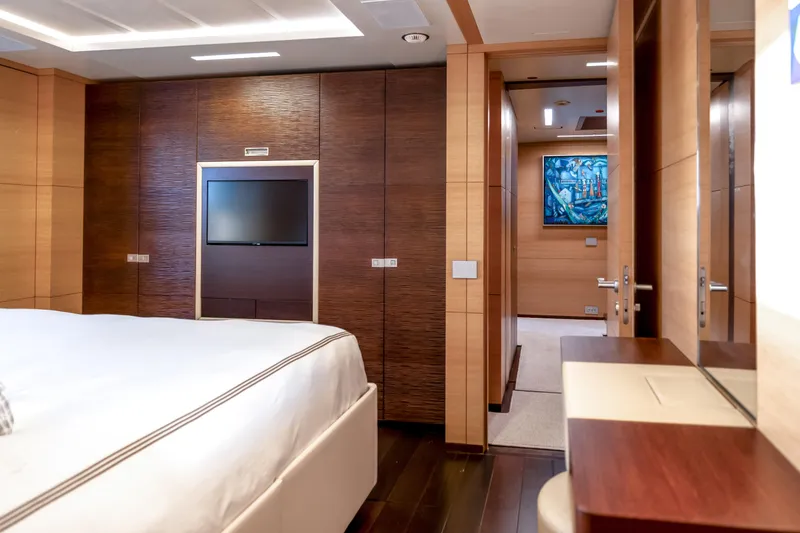 Slide: The Image of Luxurious bedroom interior on 2012 Benetti Classic Supreme 132 yacht, featuring modern wood finishes. - 18