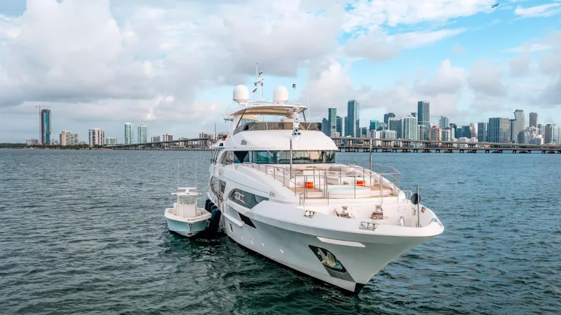 Slide: The Image of Luxury yacht Benetti Classic Supreme 132, 2012, docked with city skyline backdrop. - 2
