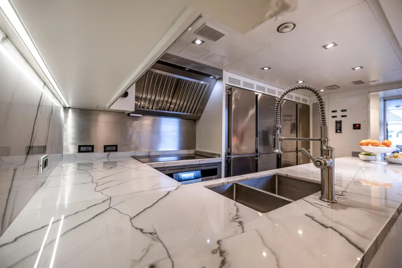 Slide: The Image of Luxurious kitchen in 2012 Benetti Classic Supreme 132 yacht with marble countertops and modern appliances. - 23