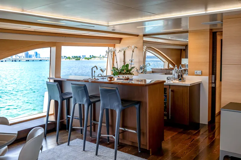 Slide: The Image of Luxurious interior of 2012 Benetti Classic Supreme 132 yacht with elegant bar and ocean view. - 28