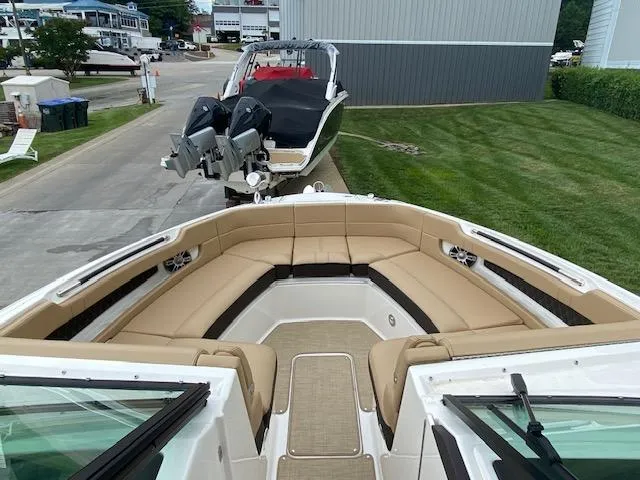 Slide: The Image of 2023 Sea Ray SLX 310 OB boat with spacious bow seating area. - 12