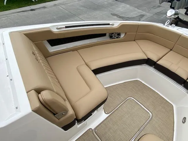 Slide: The Image of 2023 Sea Ray SLX 310 OB boat with tan leather seating. - 13
