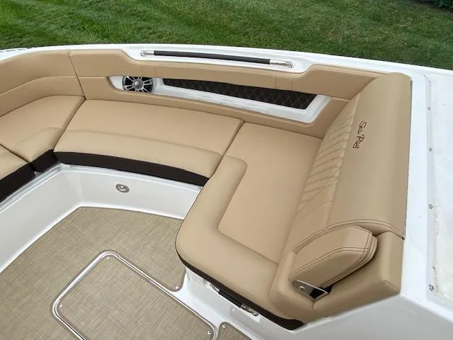 Slide: The Image of Luxurious seating area on the 2023 Sea Ray SLX 310 OB boat. - 15