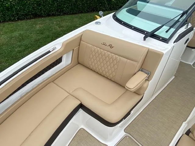 Slide: The Image of 2023 Sea Ray SLX 310 OB boat with tan leather seating and diamond stitching. - 16