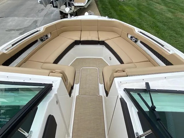 Slide: The Image of 2023 Sea Ray SLX 310 OB boat with spacious tan seating area. - 18