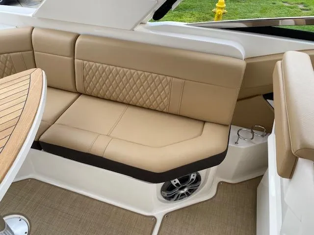 Slide: The Image of Luxurious seating area on the 2023 Sea Ray SLX 310 OB boat. - 29