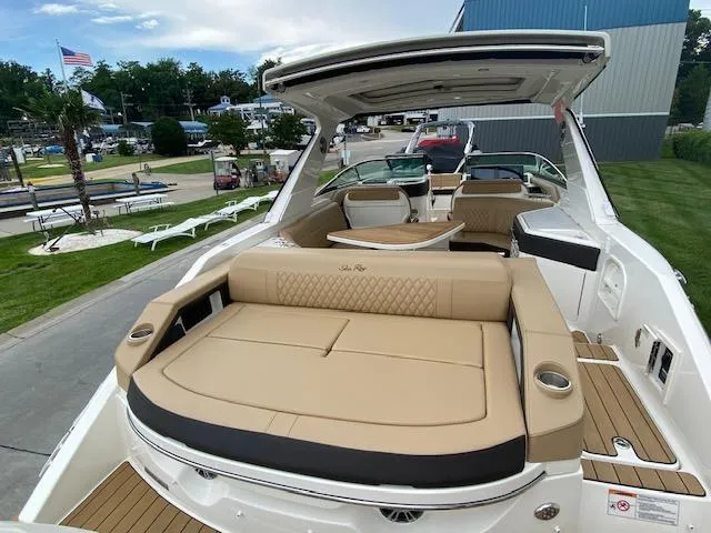 Slide: The Image of 2023 Sea Ray SLX 310 OB luxury boat with spacious seating and modern amenities. - 41
