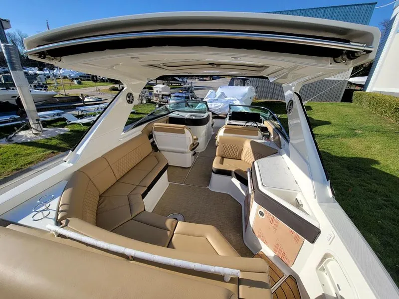 Slide: The Image of 2023 Sea Ray SLX 310 OB luxury boat interior with spacious seating. - 8