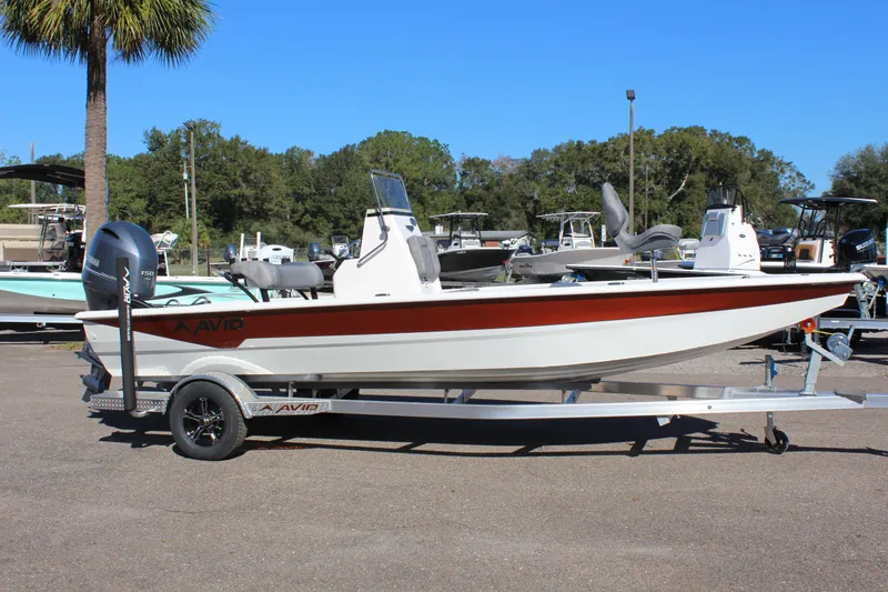 The Image of 2023 Avid 21 Mag boat on trailer in outdoor setting. - 1