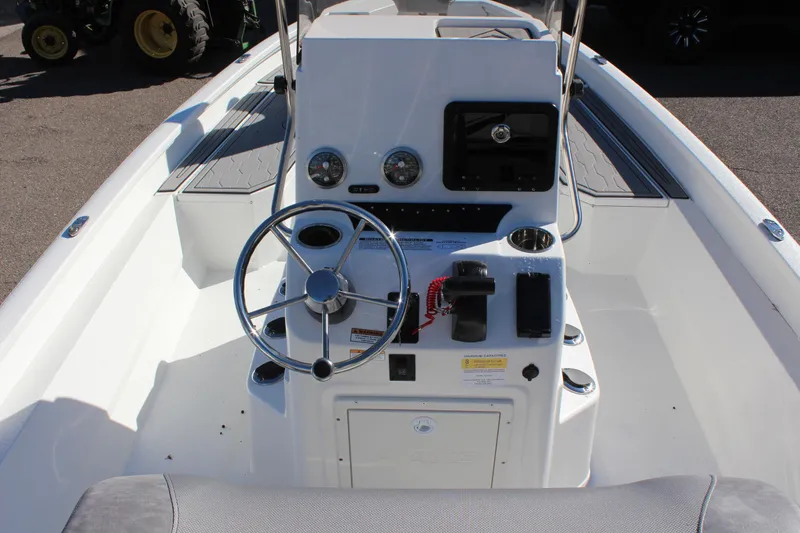 Slide: The Image of 2023 Avid 21 Mag boat console with steering wheel and control panel. - 10