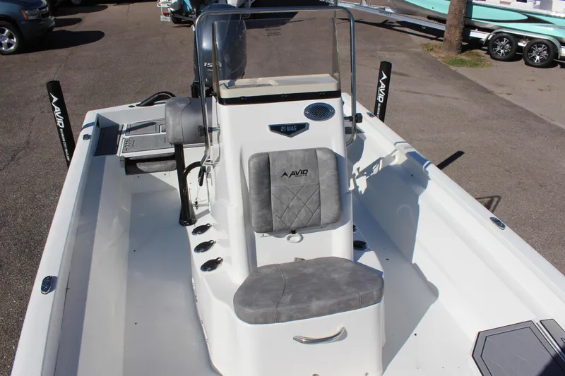 Slide: The Image of 2023 Avid 21 Mag boat interior with console and seating. - 12