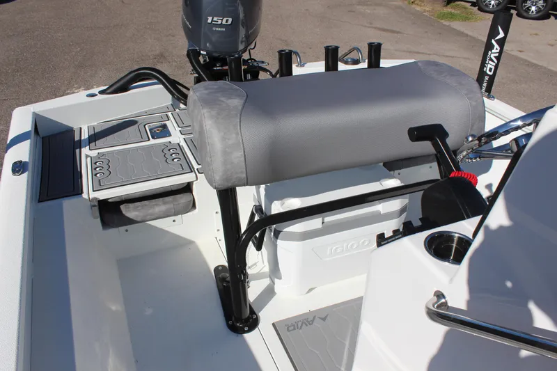 Slide: The Image of 2023 Avid 21 Mag boat interior with seating and storage compartments. - 13