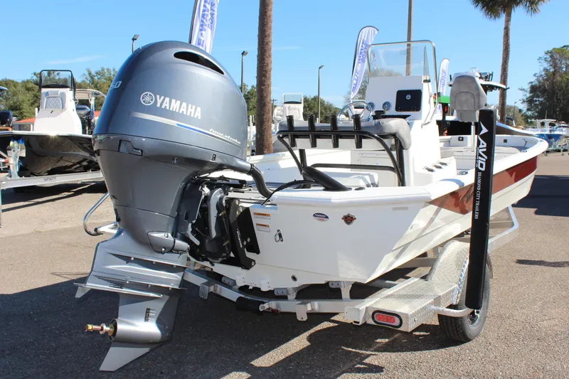 Slide: The Image of 2023 Avid 21 Mag boat with Yamaha outboard motor at a marina. - 3