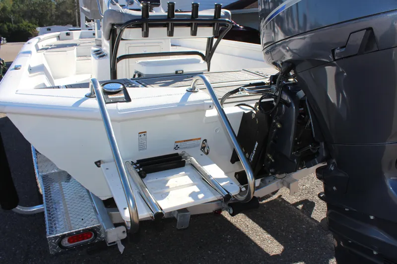 Slide: The Image of 2023 Avid 21 Mag boat with outboard motor and rear ladder. - 4