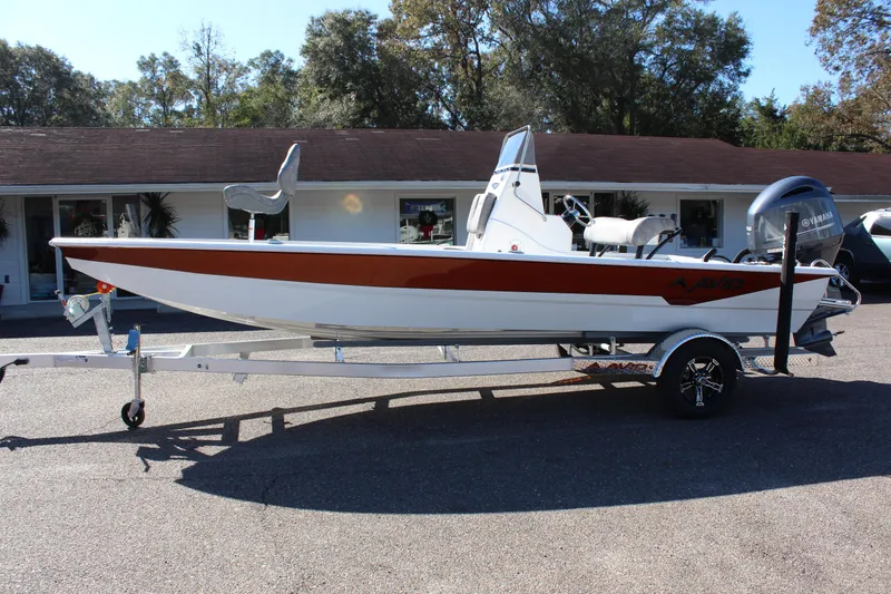Slide: The Image of 2023 Avid 21 Mag boat on trailer, parked outdoors. - 6