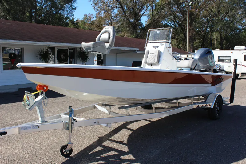 Slide: The Image of 2023 Avid 21 Mag boat on trailer, parked outdoors. - 7