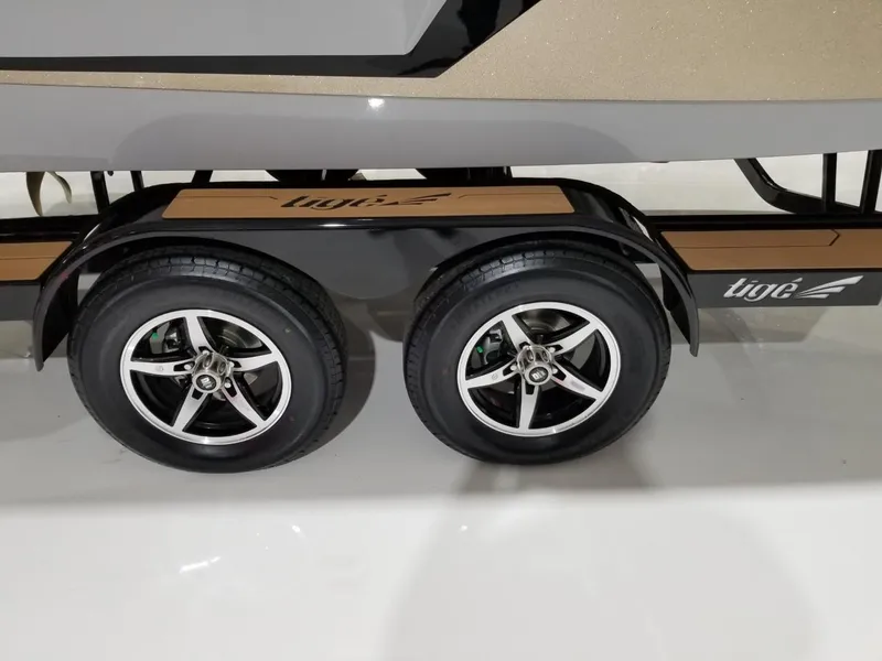 Slide: The Image of 2023 Tigé 22RZX boat trailer with dual wheels and sleek design. - 10