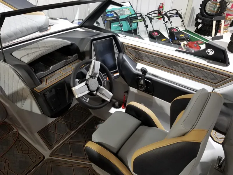 Slide: The Image of 2023 Tigé 22RZX boat interior with modern dashboard and steering wheel. - 5