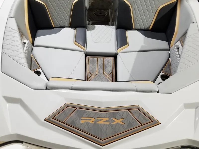 Slide: The Image of 2023 Tigé 22RZX boat interior with stylish seating and RZX logo. - 7