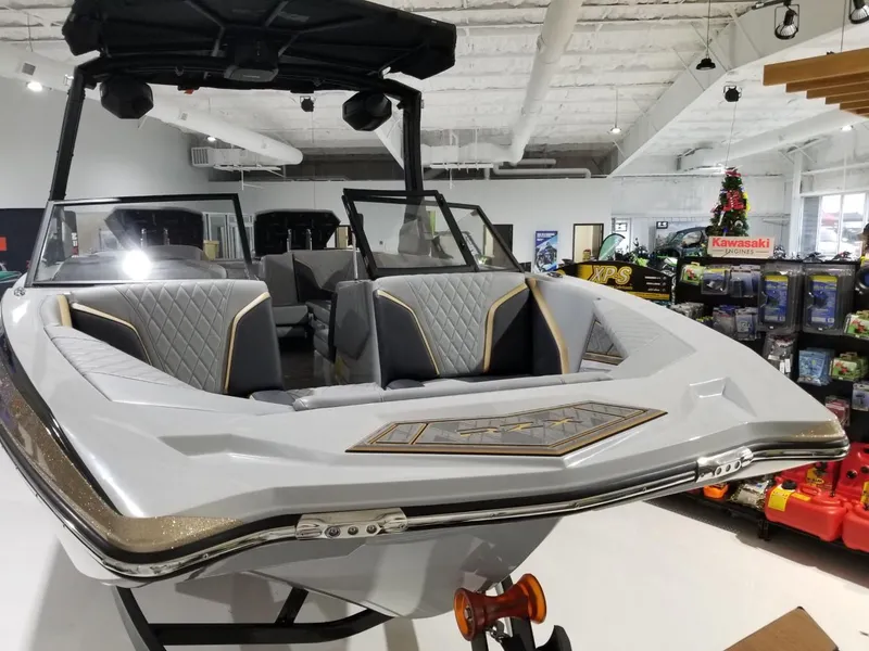 Slide: The Image of 2023 Tigé 22RZX boat on display in showroom. - 9