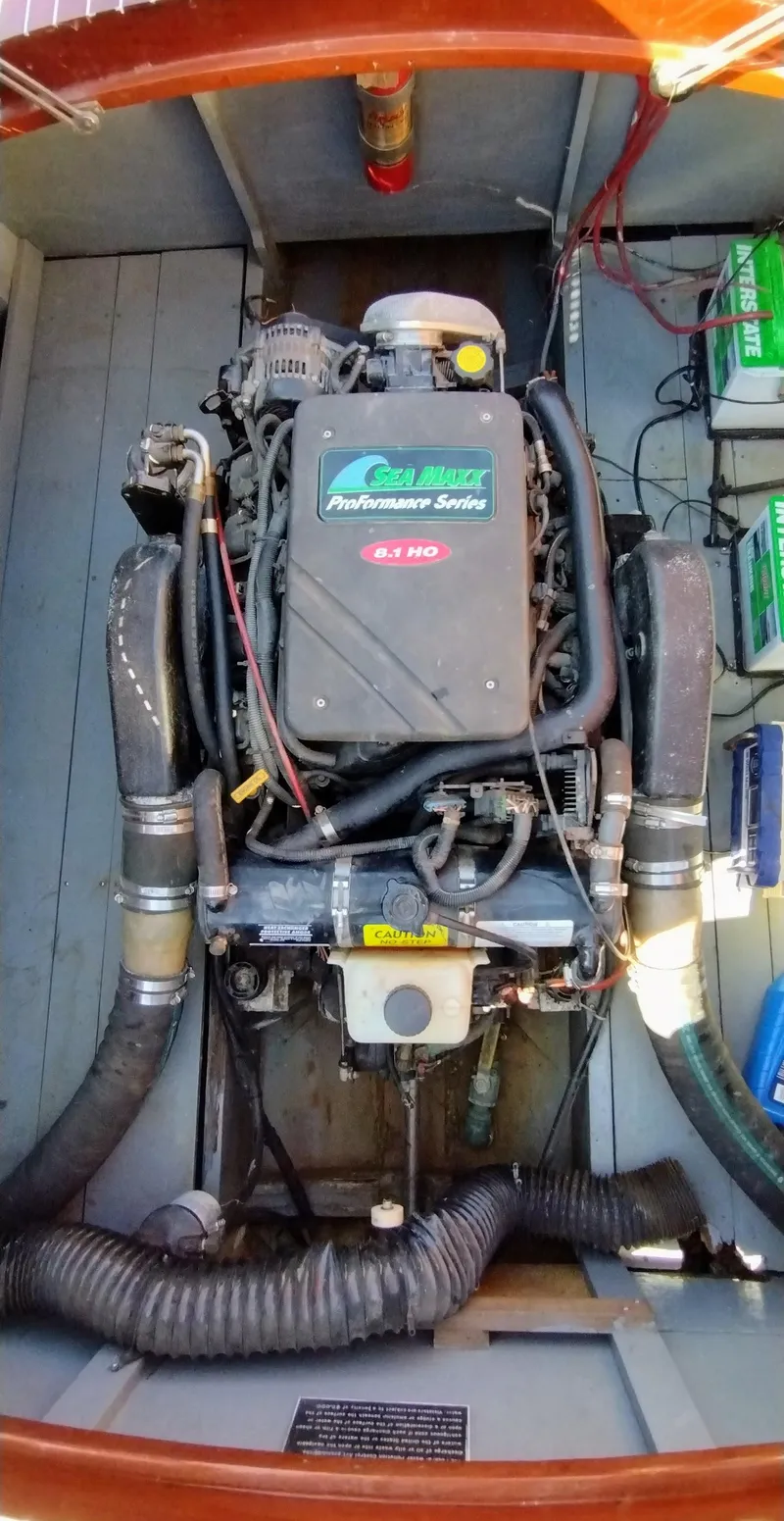 Slide: The Image of Engine of 1988 Hacker-Craft 30 Triple Cockpit boat, showcasing detailed mechanical components. - 15