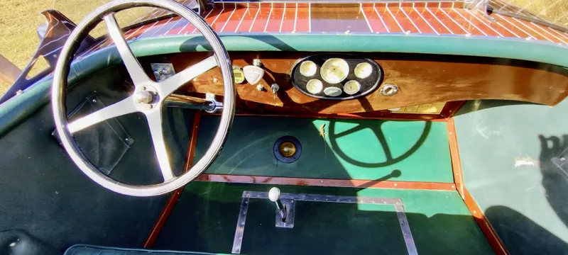 Slide: The Image of Interior of 1988 Hacker-Craft 30 Triple Cockpit with vintage steering wheel and dashboard. - 6