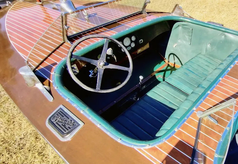 Slide: The Image of 1988 Hacker-Craft 30 Triple Cockpit with wooden deck and green interior. - 9