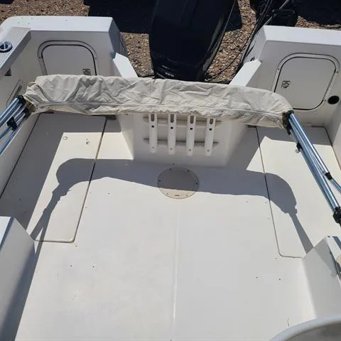 Slide: The Image of 1993 Bayliner Trophy boat interior with rod holders and storage compartments. - 5