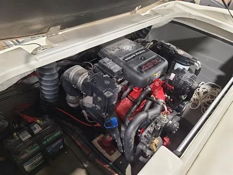 Slide: The Image of 2007 Glastron MX 175 boat engine compartment with visible components and wiring. - 11