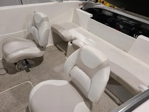 Slide: The Image of 2007 Glastron MX 175 boat interior with white and beige seating. - 3