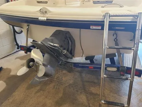 Slide: The Image of 2004 Glastron GX 235 boat stern with propeller and ladder. - 4