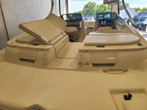 Slide: The Image of 2004 Glastron GX 235 boat interior with open storage compartments. - 5
