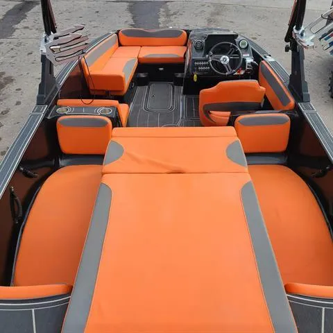 Slide: The Image of 2018 Heyday WT-1 SC boat interior with orange and gray seating. - 2