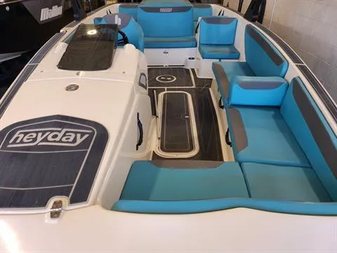 Slide: The Image of 2018 Heyday WT-2 boat interior with blue and gray seating. - 2