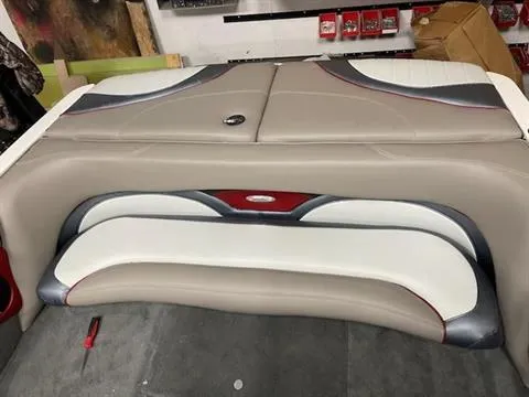 Slide: The Image of 2007 Malibu Response LXi boat interior seating in beige, white, and red. - 5