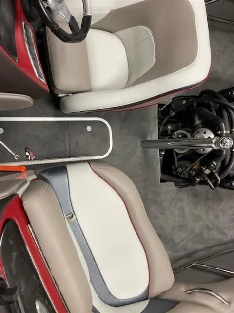 Slide: The Image of 2007 Malibu Response LXi boat interior with seats and engine visible. - 7