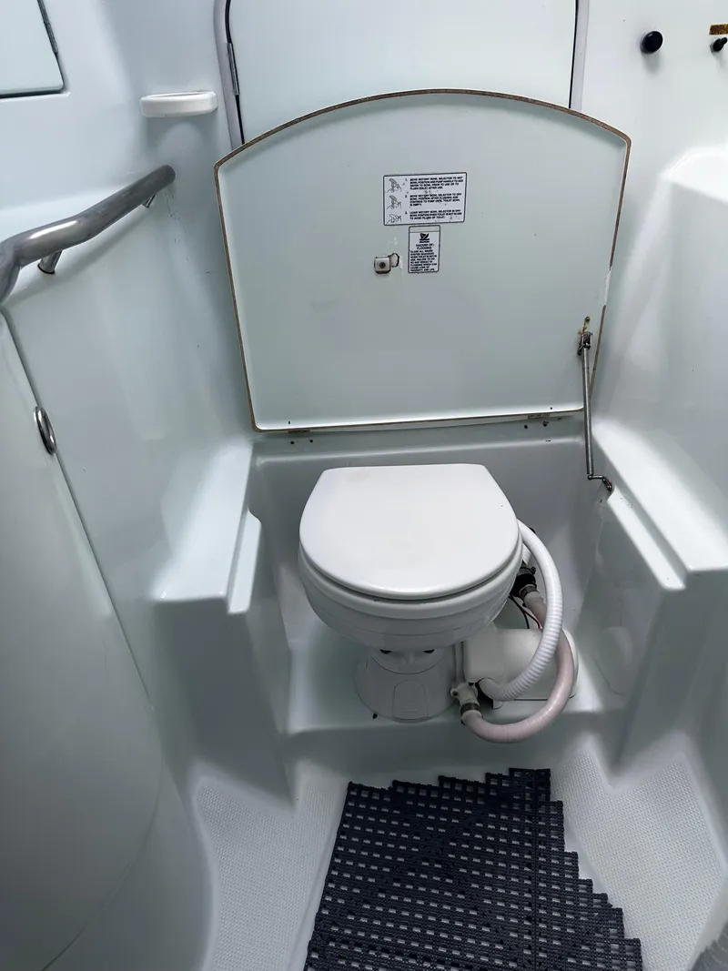 Slide: The Image of 1994 Beneteau Oceanis 405 yacht bathroom with toilet and handrail. - 17