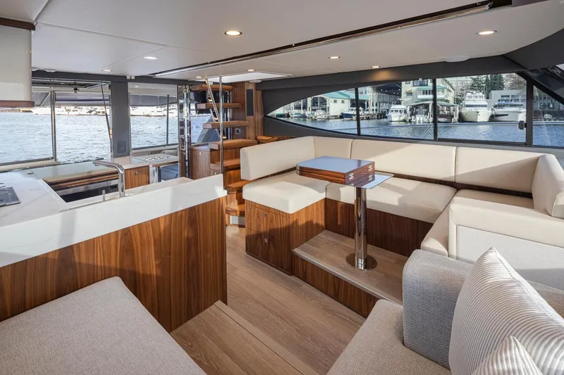 Slide: The Image of Luxurious interior of the 2024 Riviera 46 Sports Motor Yacht with waterfront views. - 24