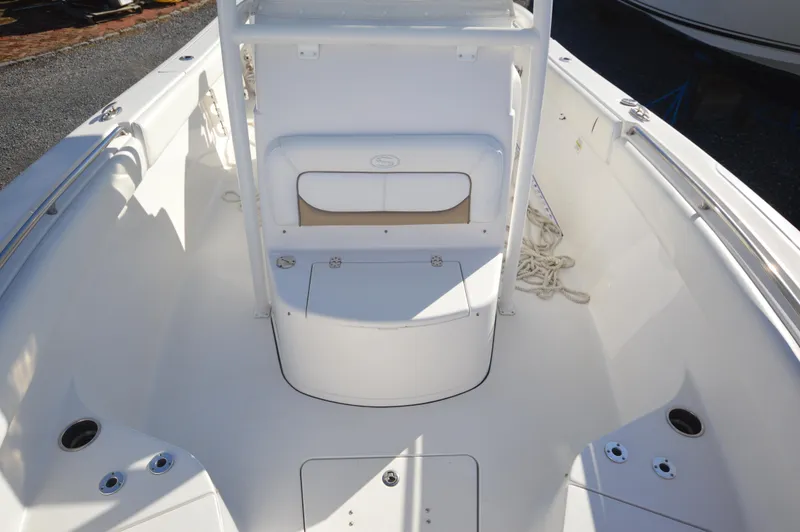 Slide: The Image of 2015 Sportsman 25 Center Console boat interior, white deck, and seating area. - 12