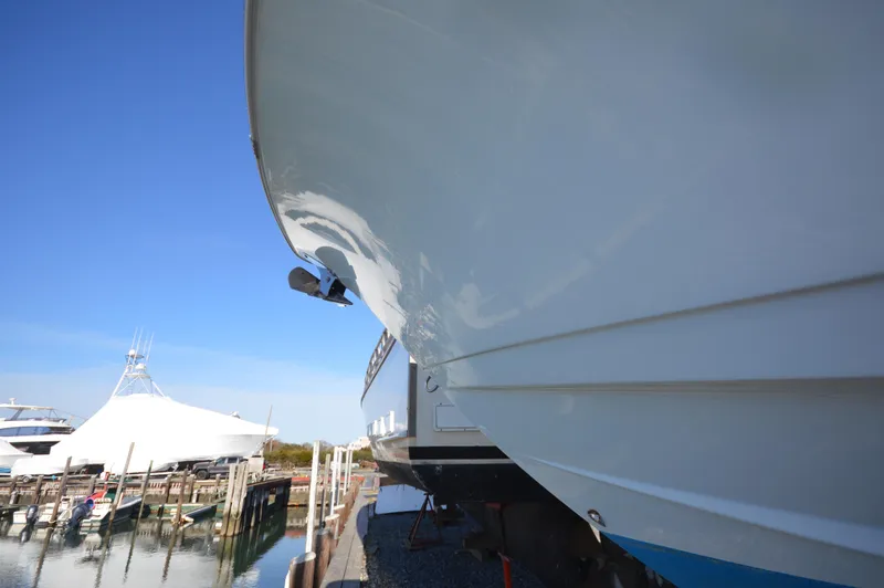 Slide: The Image of 2015 Sportsman 25 Center Console boat docked at a marina. - 14