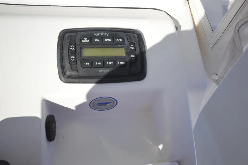 Slide: The Image of Infinity audio system on 2015 Sportsman 25 Center Console boat. - 15