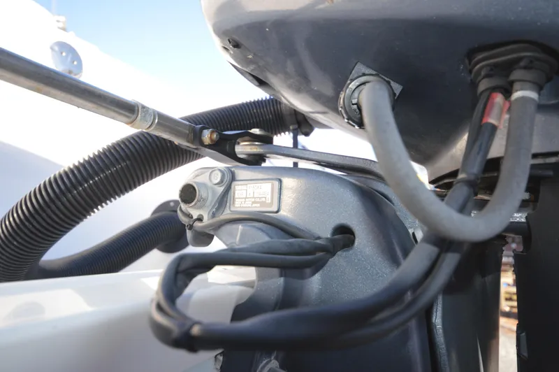 Slide: The Image of Close-up of the engine components on a 2015 Sportsman 25 Center Console boat. - 17