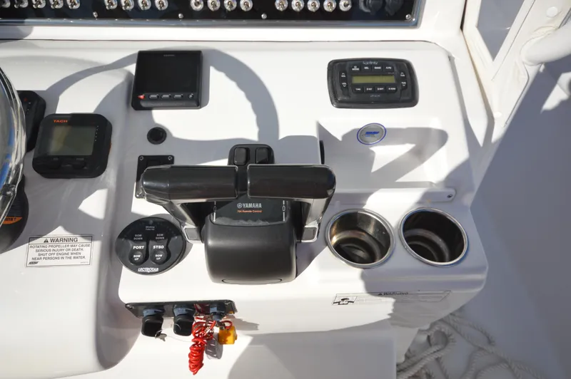 Slide: The Image of Control panel of a 2015 Sportsman 25 Center Console boat with Yamaha throttle. - 19