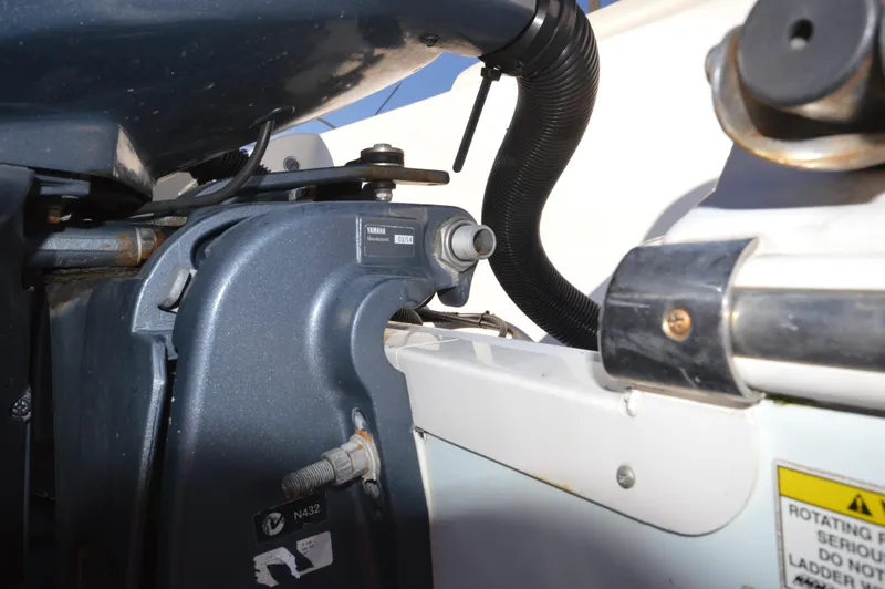 Slide: The Image of Close-up of the engine mount on a 2015 Sportsman 25 Center Console boat. - 24