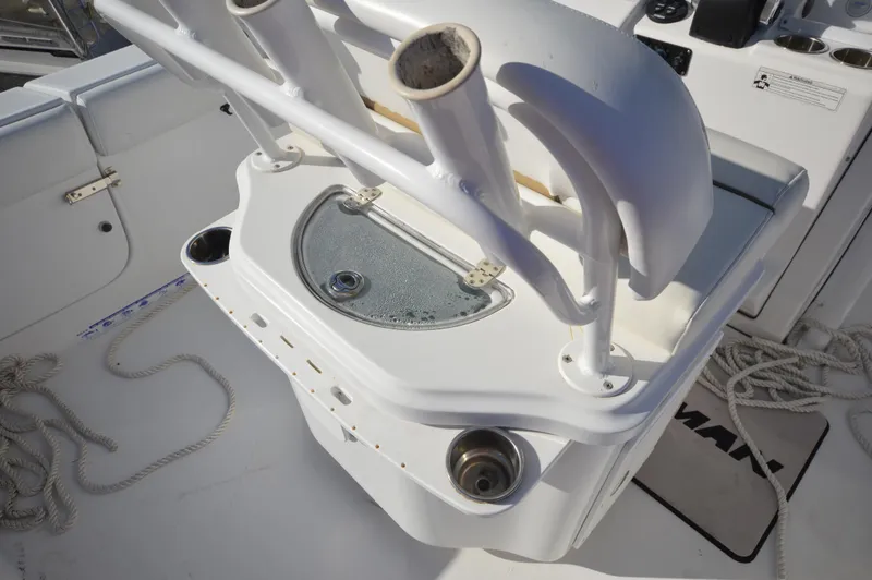 Slide: The Image of 2015 Sportsman 25 Center Console boat with rod holders and storage compartment. - 26